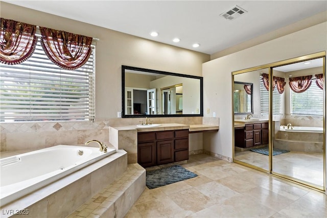 2010 Catalina Marie Ave, Henderson, NV 89074 - bathroom with vanity, a garden tub, and recessed lighting
