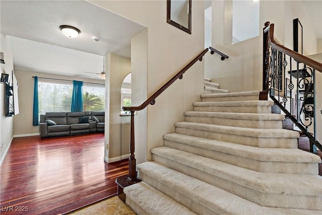 2010 Catalina Marie Ave, Henderson, NV 89074 - stairway featuring a ceiling fan, wood finished floors, and arched walkways