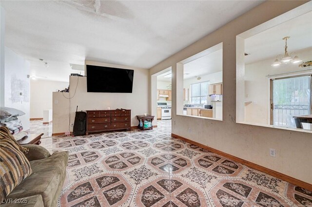 5907 Zawawi Ct, Las Vegas, NV 89110 - living room with baseboards