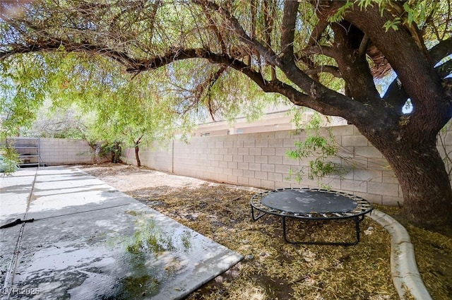 5907 Zawawi Ct, Las Vegas, NV 89110 - fenced backyard with a patio area
