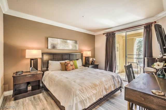 230 E Flamingo Rd Unit 203, Las Vegas, NV 89169 - bedroom featuring ornamental molding, light wood finished floors, and access to exterior