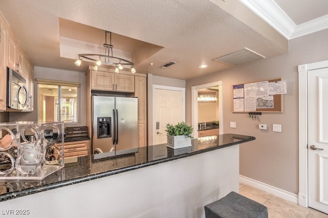 230 E Flamingo Rd Unit 203, Las Vegas, NV 89169 - kitchen with appliances with stainless steel finishes, light tile patterned floors, dark stone counters, a peninsula, and light brown cabinets