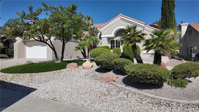 2633 Legend Dr, Las Vegas, NV 89134 - view of front facade featuring driveway, a tile roof, and stucco siding