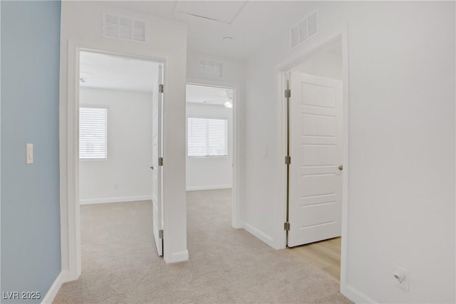 3621 Arcadian Sea St, Las Vegas, NV 89106 - hallway featuring light colored carpet and attic access