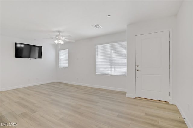 3621 Arcadian Sea St, Las Vegas, NV 89106 - unfurnished living room featuring a ceiling fan and light wood-style floors