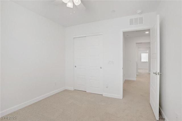 3621 Arcadian Sea St, Las Vegas, NV 89106 - unfurnished bedroom featuring light carpet, a closet, and a ceiling fan