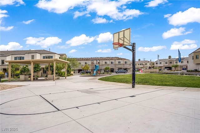 3621 Arcadian Sea St, Las Vegas, NV 89106 - view of basketball court featuring a residential view and a lawn