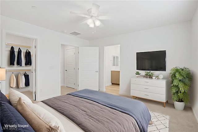 3621 Arcadian Sea St, Las Vegas, NV 89106 - bedroom with a walk in closet, light colored carpet, ceiling fan, ensuite bathroom, and a closet