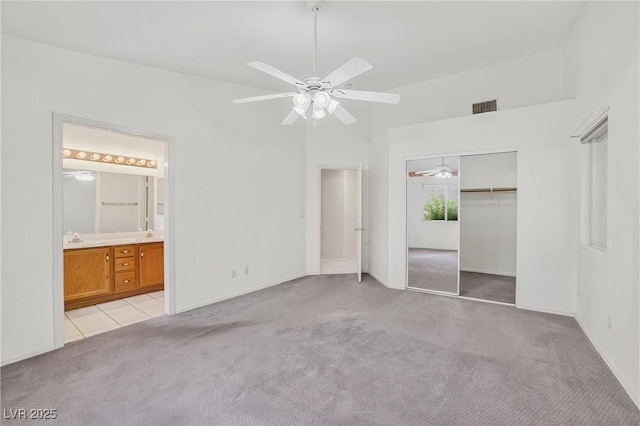 114 Tamarack Dr, Henderson, NV 89002 - unfurnished bedroom with light colored carpet, a closet, a ceiling fan, and ensuite bathroom