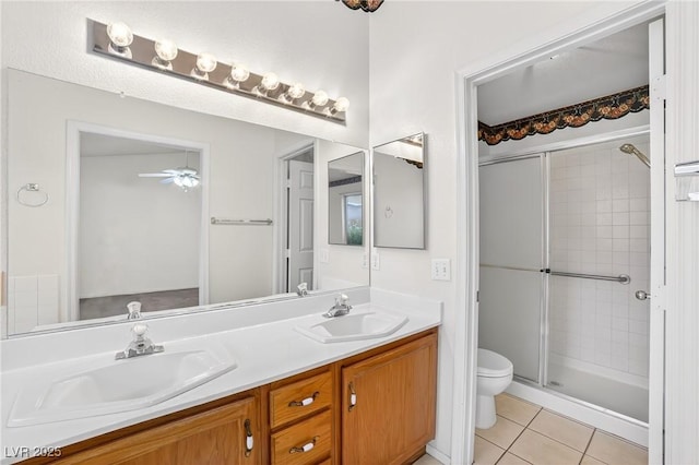 114 Tamarack Dr, Henderson, NV 89002 - full bathroom featuring a stall shower, double vanity, a ceiling fan, and tile patterned flooring
