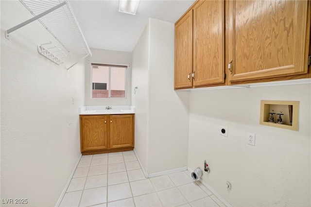 114 Tamarack Dr, Henderson, NV 89002 - laundry room with gas dryer hookup, electric dryer hookup, washer hookup, light tile patterned floors, and cabinet space