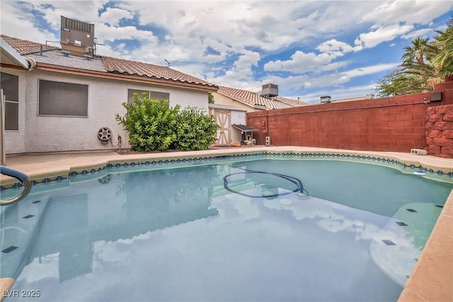 114 Tamarack Dr, Henderson, NV 89002 - view of pool featuring a shed and a fenced backyard