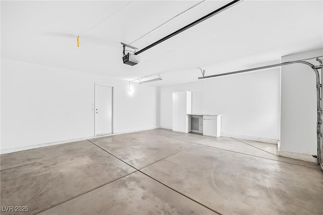 114 Tamarack Dr, Henderson, NV 89002 - garage featuring a garage door opener and baseboards