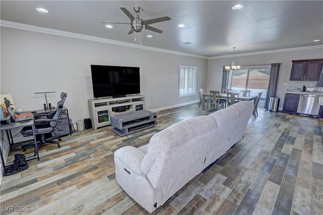 210 Magnolia Blvd, Pahrump, NV 89048 - living area with a chandelier, ceiling fan, wood finished floors, recessed lighting, and crown molding