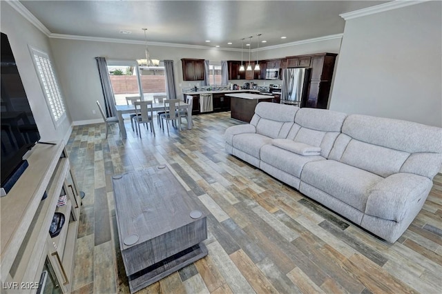 210 Magnolia Blvd, Pahrump, NV 89048 - living area with a chandelier, light wood-type flooring, recessed lighting, and ornamental molding