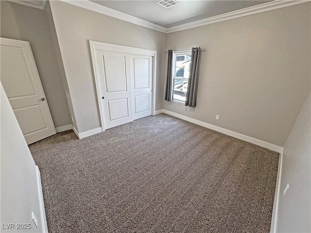 210 Magnolia Blvd, Pahrump, NV 89048 - unfurnished bedroom featuring crown molding, carpet flooring, and a closet