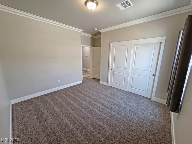 210 Magnolia Blvd, Pahrump, NV 89048 - unfurnished bedroom with ornamental molding, a closet, and carpet