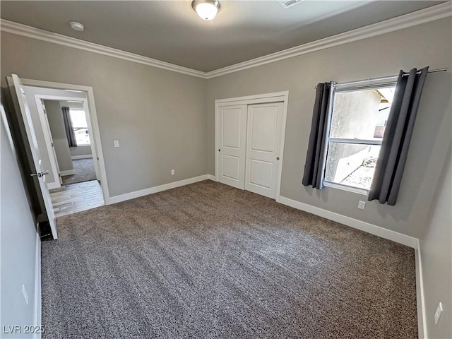 210 Magnolia Blvd, Pahrump, NV 89048 - unfurnished bedroom with carpet flooring, ornamental molding, multiple windows, and a closet