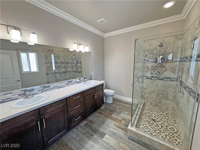 210 Magnolia Blvd, Pahrump, NV 89048 - bathroom with double vanity, a shower stall, ornamental molding, and wood finished floors