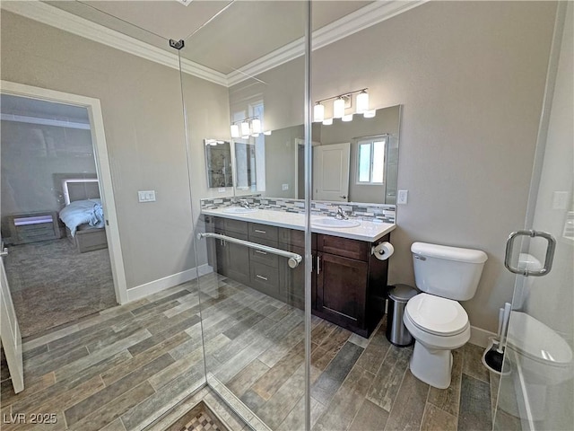 210 Magnolia Blvd, Pahrump, NV 89048 - ensuite bathroom featuring crown molding, double vanity, wood finished floors, and an enclosed shower