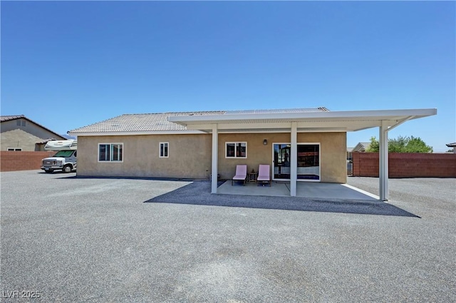 210 Magnolia Blvd, Pahrump, NV 89048 - back of property featuring stucco siding and a patio
