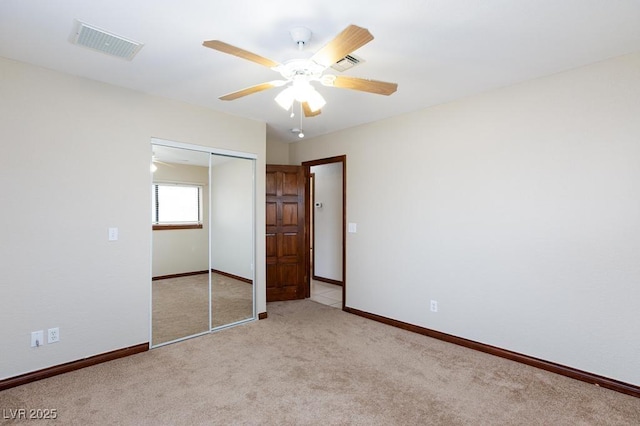 1050 Morgan Ln, Pahrump, NV 89060 - unfurnished bedroom with light carpet, a closet, and a ceiling fan