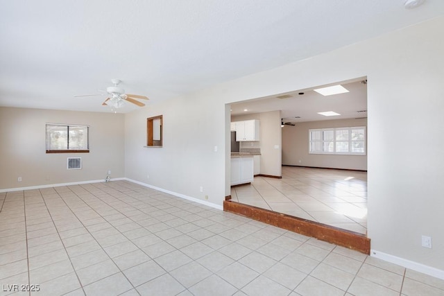1050 Morgan Ln, Pahrump, NV 89060 - empty room with ceiling fan and light tile patterned flooring