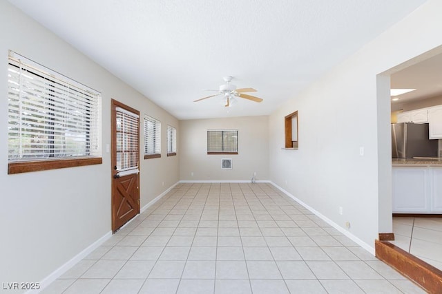 1050 Morgan Ln, Pahrump, NV 89060 - unfurnished room with a ceiling fan and light tile patterned flooring
