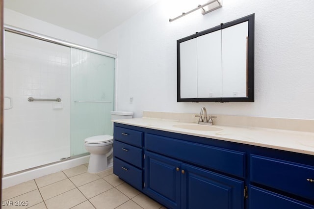 1050 Morgan Ln, Pahrump, NV 89060 - full bath featuring vanity, a stall shower, and tile patterned flooring