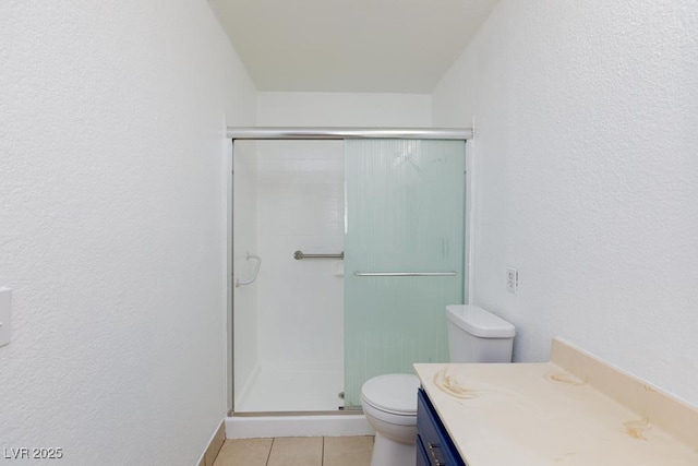 1050 Morgan Ln, Pahrump, NV 89060 - bathroom featuring a shower stall, vanity, tile patterned flooring, and a textured wall