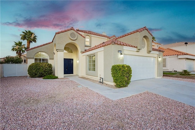 2107 Fountain Springs Dr, Henderson, NV 89074 - mediterranean / spanish house with driveway, stucco siding, and a tiled roof