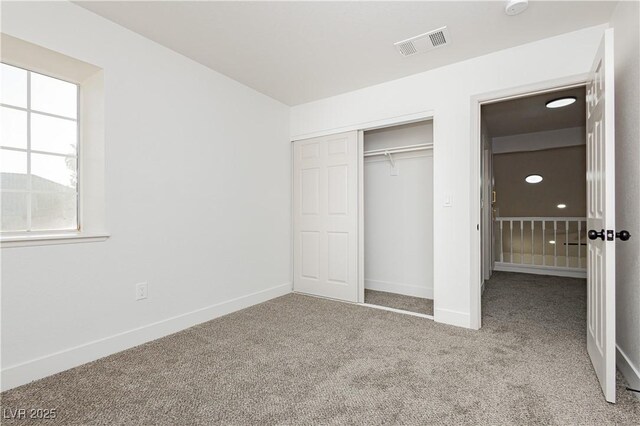2107 Fountain Springs Dr, Henderson, NV 89074 - unfurnished bedroom featuring carpet and a closet