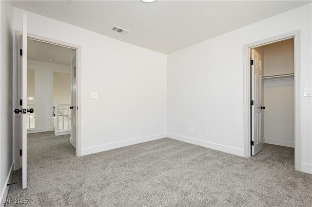 2107 Fountain Springs Dr, Henderson, NV 89074 - unfurnished bedroom featuring carpet and a walk in closet