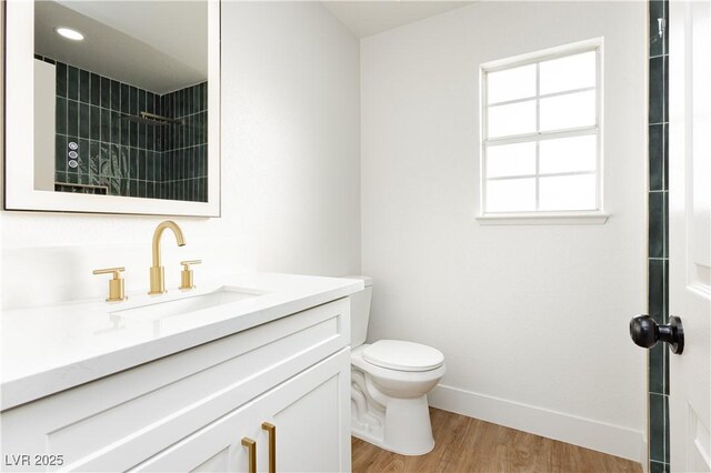 2107 Fountain Springs Dr, Henderson, NV 89074 - bathroom featuring vanity, wood finished floors, and a shower