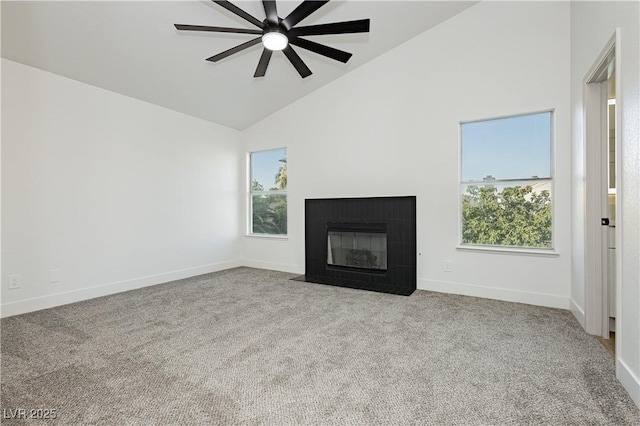 2107 Fountain Springs Dr, Henderson, NV 89074 - unfurnished living room with high vaulted ceiling, healthy amount of natural light, a ceiling fan, carpet floors, and a fireplace with flush hearth