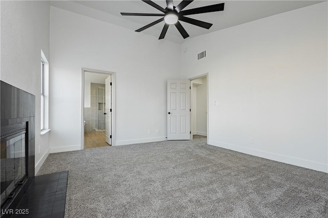 2107 Fountain Springs Dr, Henderson, NV 89074 - unfurnished bedroom with carpet floors, high vaulted ceiling, connected bathroom, and a ceiling fan