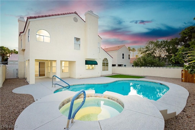 2107 Fountain Springs Dr, Henderson, NV 89074 - view of pool with a patio, a fenced backyard, and a pool with connected hot tub
