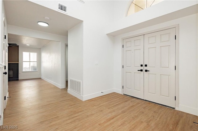2107 Fountain Springs Dr, Henderson, NV 89074 - foyer with light wood-type flooring and a fireplace