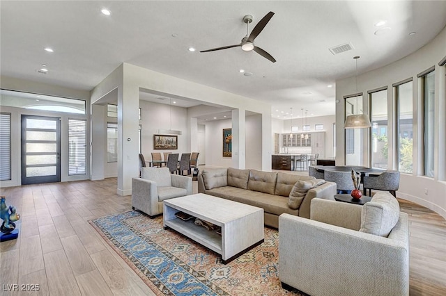 33 Hassayampa Trl, Henderson, NV 89052 - living area with plenty of natural light, light wood-style floors, ceiling fan, and recessed lighting