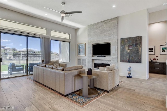 33 Hassayampa Trl, Henderson, NV 89052 - living area featuring light wood-style floors, a fireplace, a ceiling fan, and recessed lighting