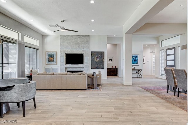 33 Hassayampa Trl, Henderson, NV 89052 - living area featuring ceiling fan, light wood finished floors, healthy amount of natural light, and recessed lighting