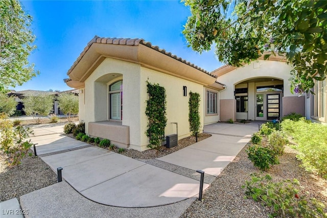 33 Hassayampa Trl, Henderson, NV 89052 - view of home's exterior with a tile roof and stucco siding