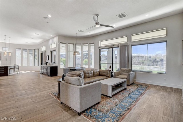 33 Hassayampa Trl, Henderson, NV 89052 - living room featuring plenty of natural light, recessed lighting, light wood-style flooring, and a ceiling fan