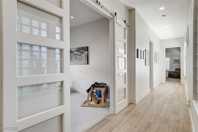 33 Hassayampa Trl, Henderson, NV 89052 - hall with a barn door, wood finished floors, and recessed lighting