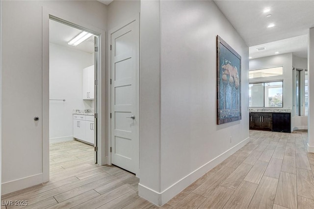 33 Hassayampa Trl, Henderson, NV 89052 - corridor featuring light wood finished floors and recessed lighting