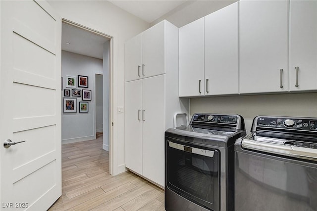 33 Hassayampa Trl, Henderson, NV 89052 - laundry room featuring cabinet space, washer and clothes dryer, and light wood-style floors