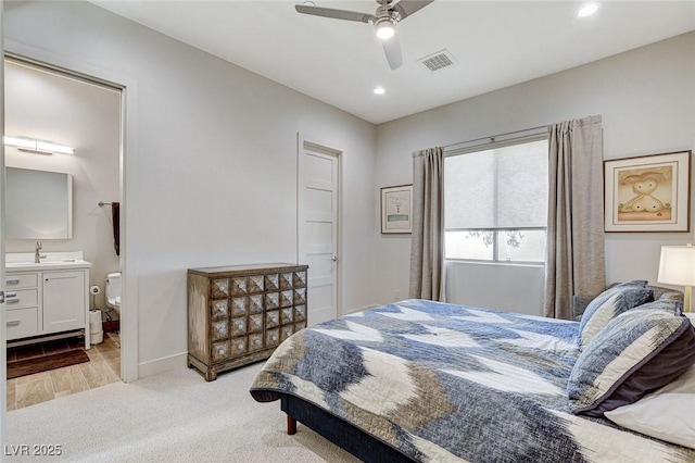 33 Hassayampa Trl, Henderson, NV 89052 - bedroom with recessed lighting, light colored carpet, ceiling fan, and connected bathroom