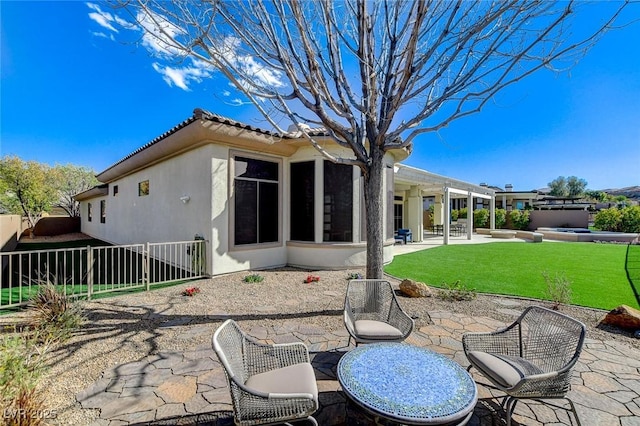 33 Hassayampa Trl, Henderson, NV 89052 - rear view of house with a patio area, a tiled roof, stucco siding, and a jacuzzi