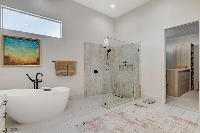 33 Hassayampa Trl, Henderson, NV 89052 - bathroom featuring a walk in shower, a freestanding bath, tile patterned flooring, and recessed lighting