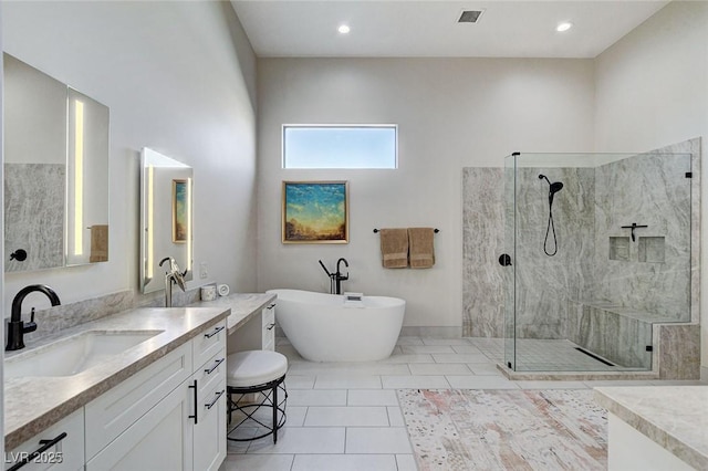33 Hassayampa Trl, Henderson, NV 89052 - bathroom with vanity, a tile shower, a freestanding bath, tile patterned flooring, and recessed lighting